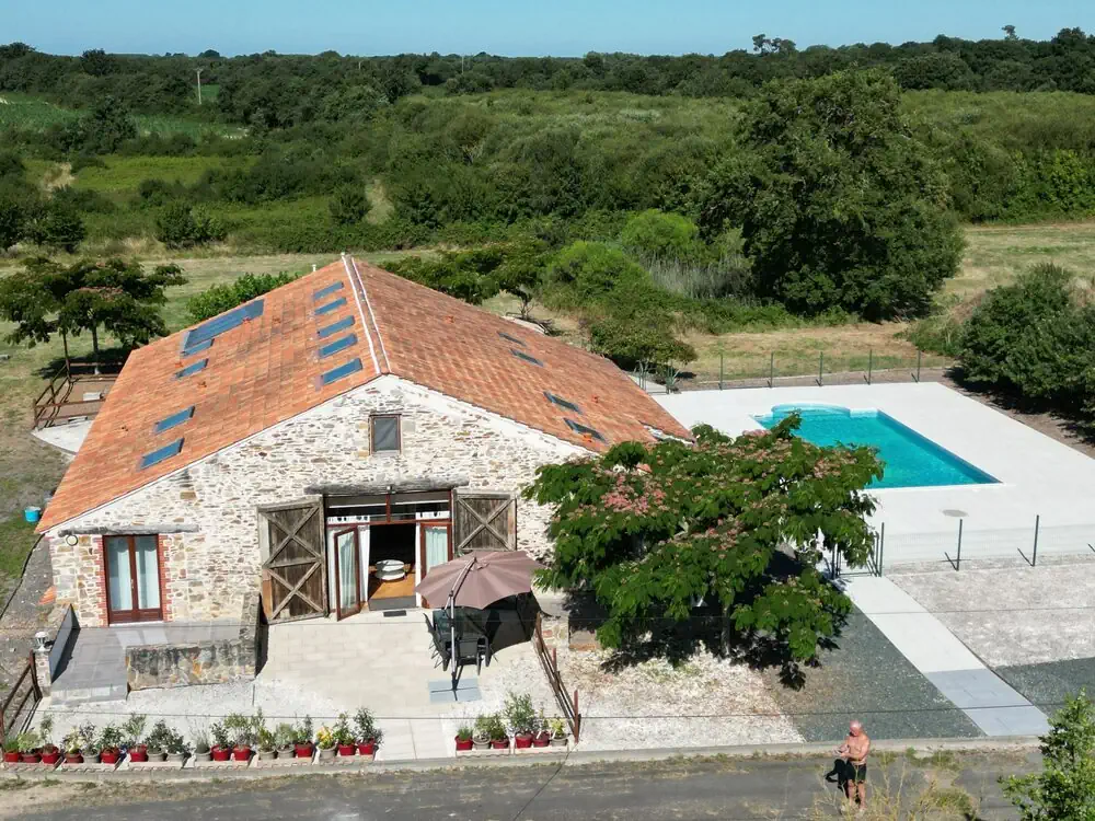 Exterior view of La Lumière Est, a spacious holiday gîte at Le Village du Bois set in the Vendée countryside